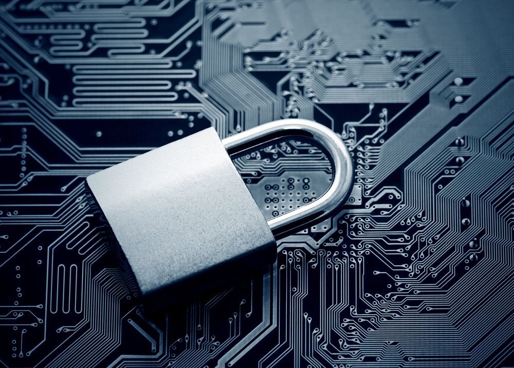 A Padlock Is Sitting On Top Of A Computer Motherboard — Troy Cummings Locksmith In Mossman, QLD