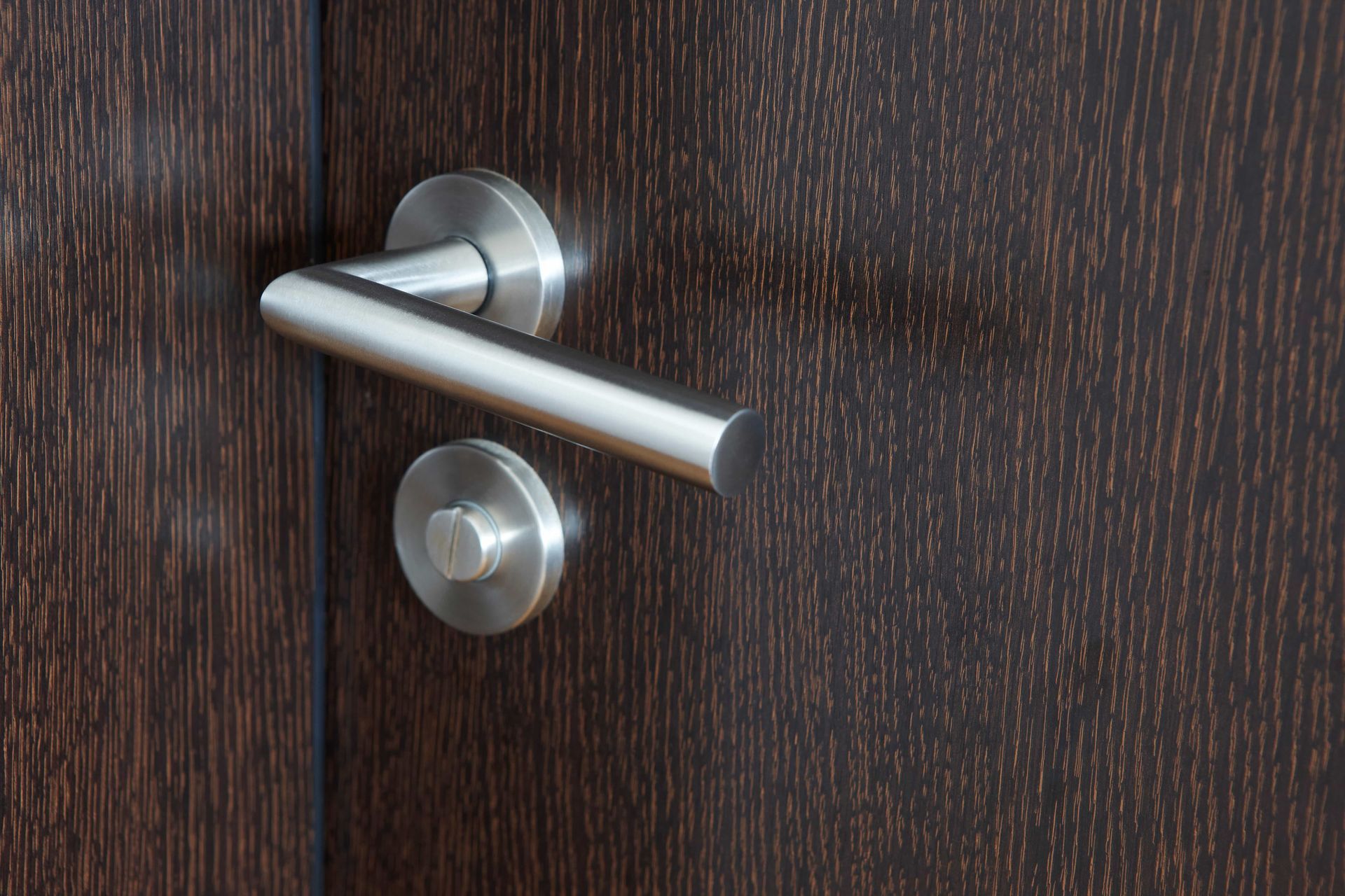 A Close Up Of A Door Handle On A Wooden Door — Troy Cummings Locksmith In Port Douglas, QLD
