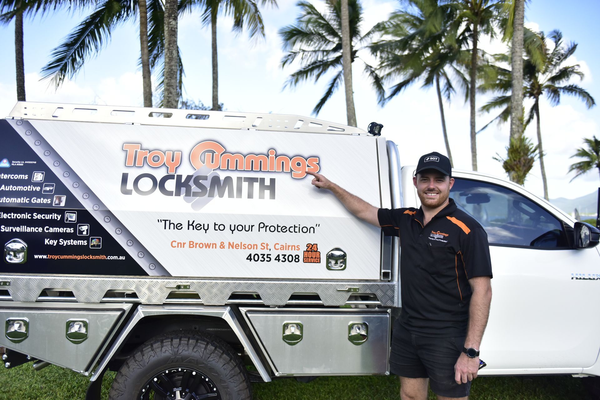 Car Key Is Being Cut By A Machine — Troy Cummings Locksmith In Bungalow, QLD