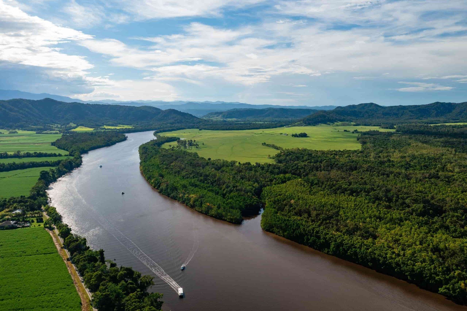 An Aerial View Of A River Surrounded By Trees And Fields — Troy Cummings Locksmith In Cape Tribulation, QLD