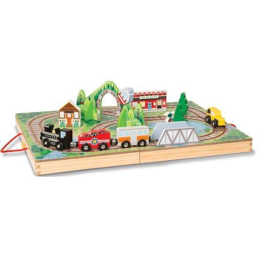 A wooden train set is sitting on top of a wooden table.