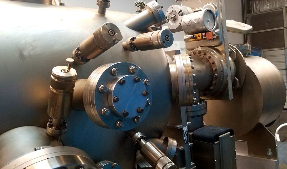 A close up of a machine with a lot of pipes and valves