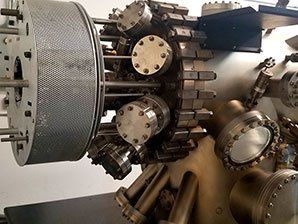 A large metal machine is sitting on top of a table.