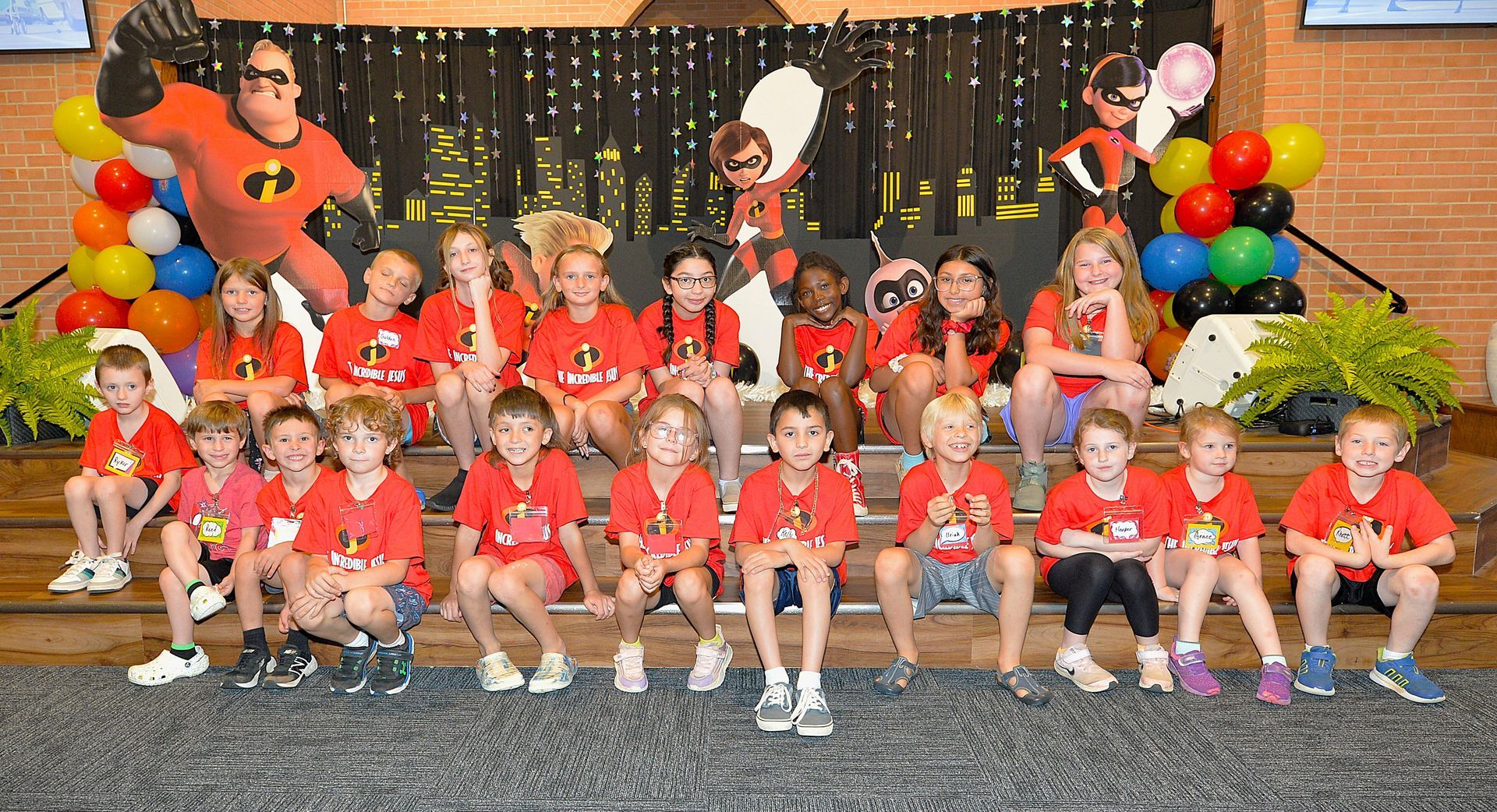 A group of children are posing for a picture in a church.