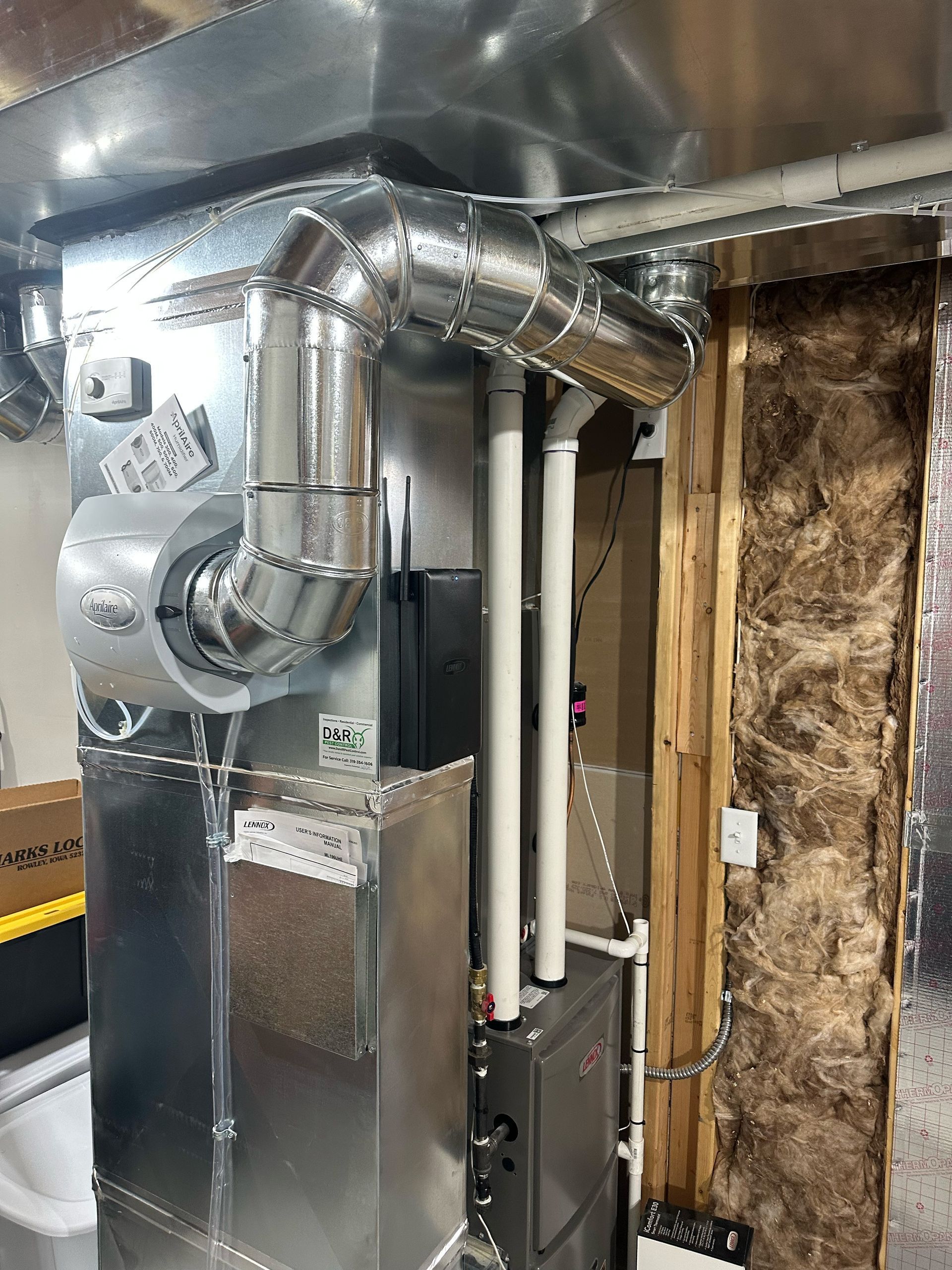 A picture of a heating system in a basement.
