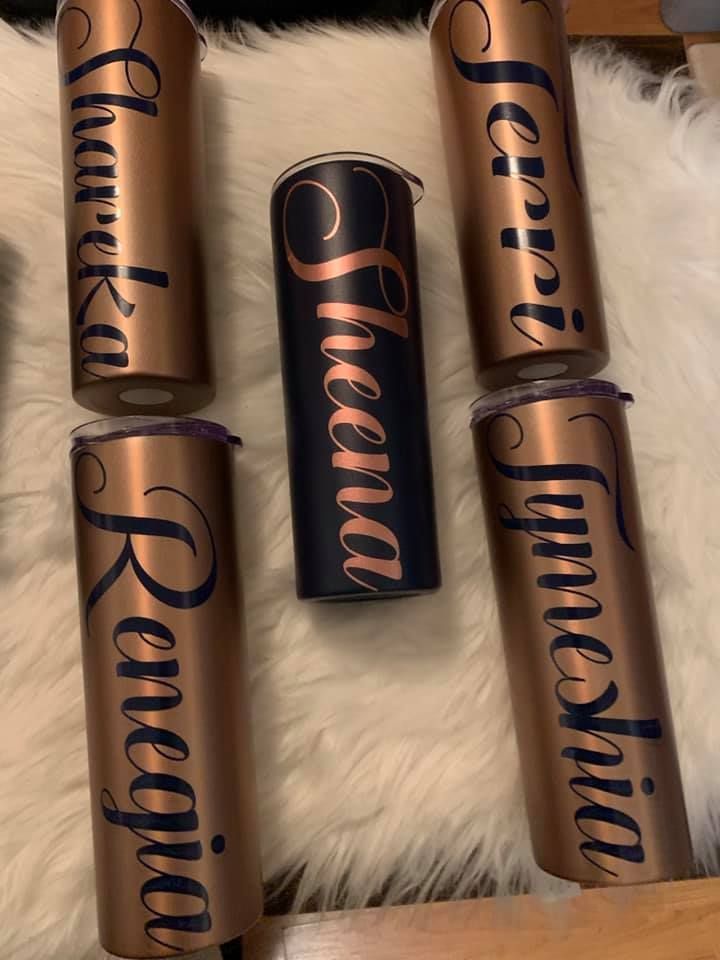 Three stainless steel tumblers with names on them