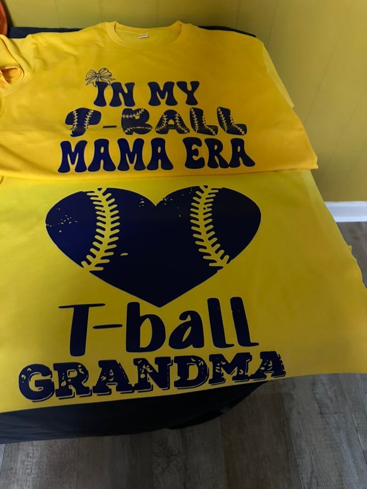 A yellow shirt that says in my p-ball mama era t-ball grandma
