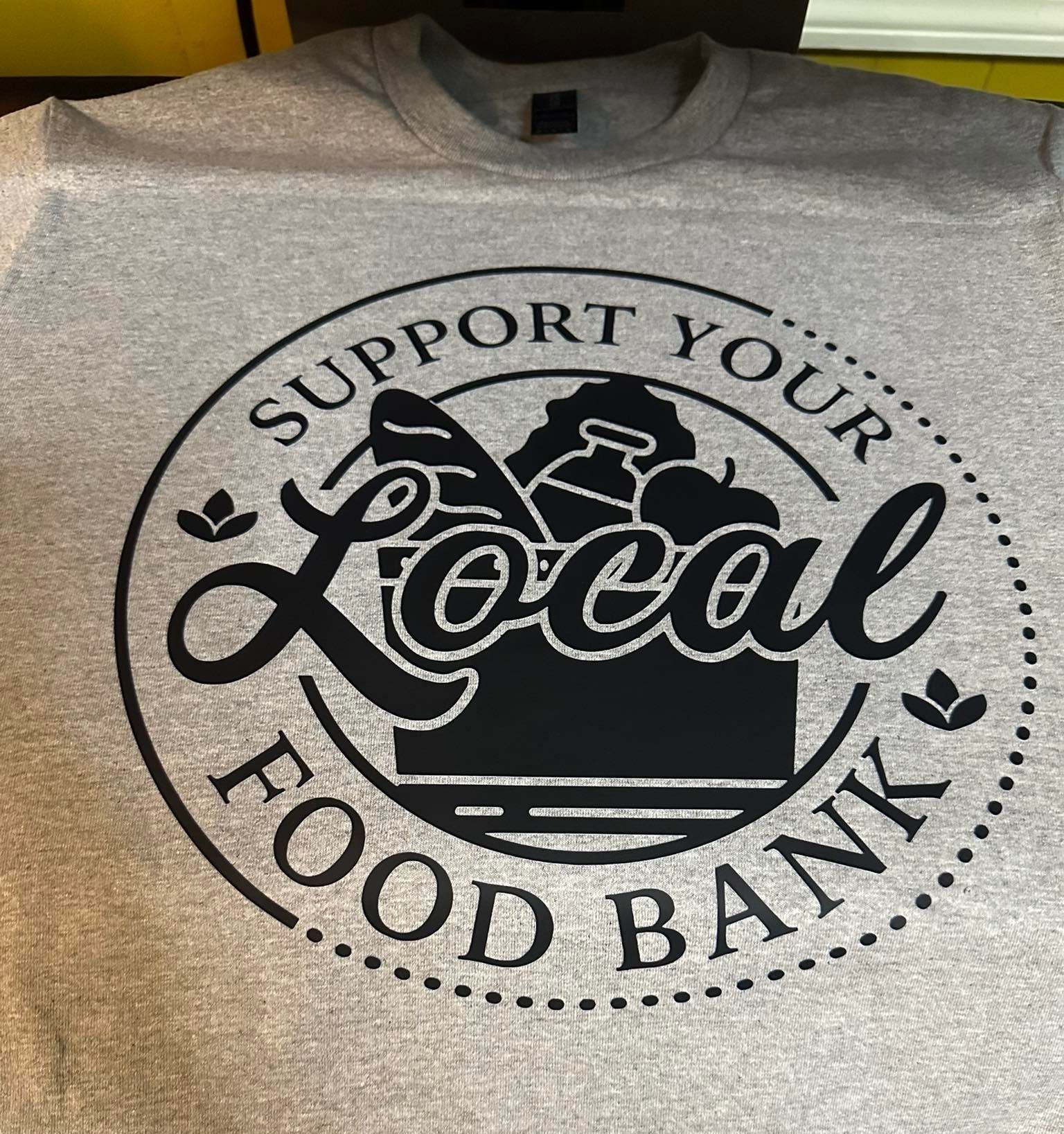 A t-shirt that says support your local food bank