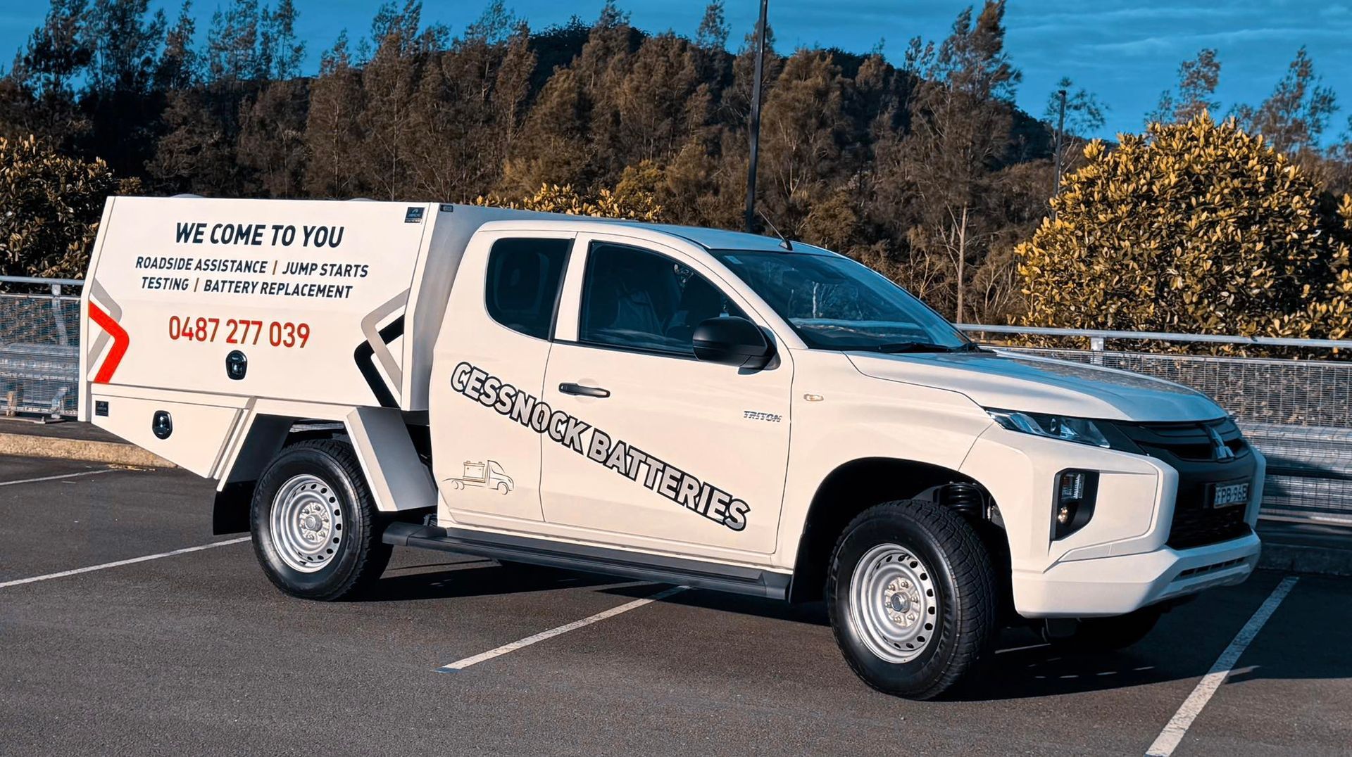 A Person is Working on a Car Battery — Cessnock Batteries In Bellbird, NSW