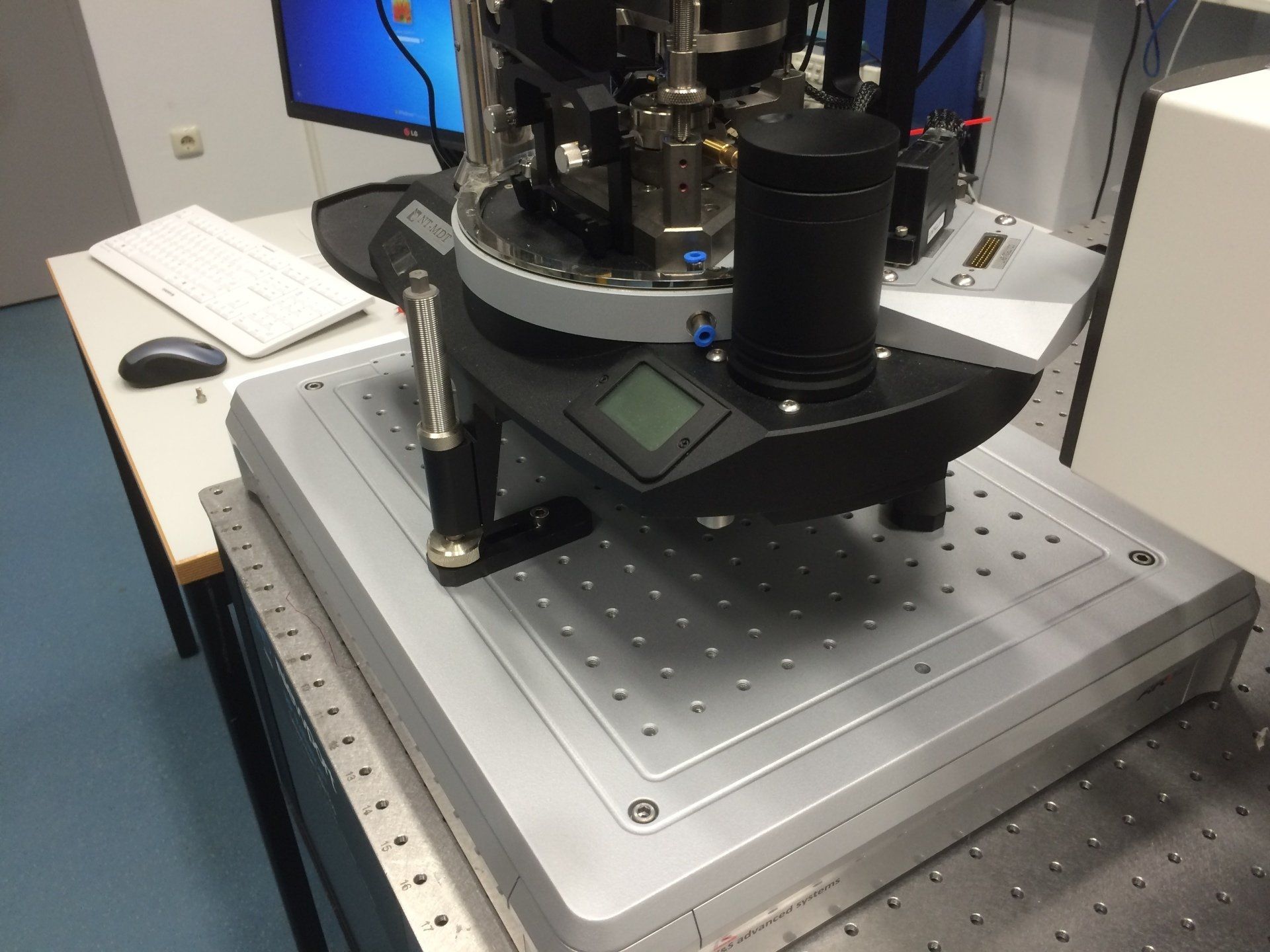 Precision instrument mounted on a vibration isolation platform in a laboratory setting