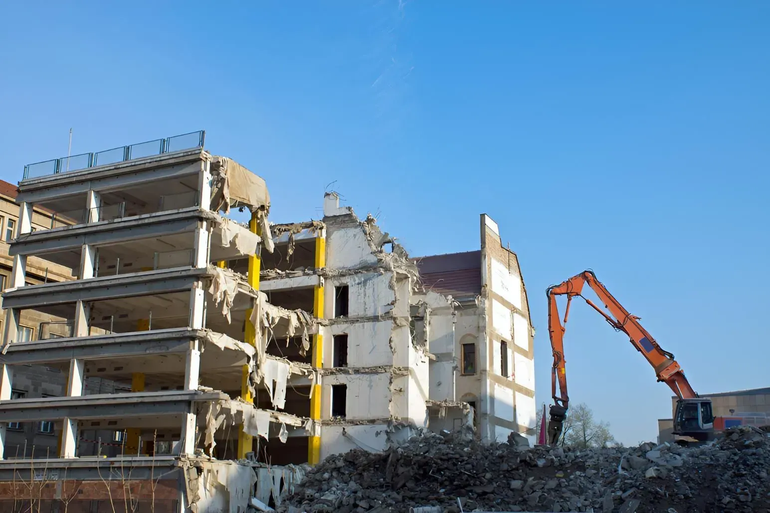 Demolition of a Multi-Story Building by an Excavator — Boland Contracting In Wellington, NSW