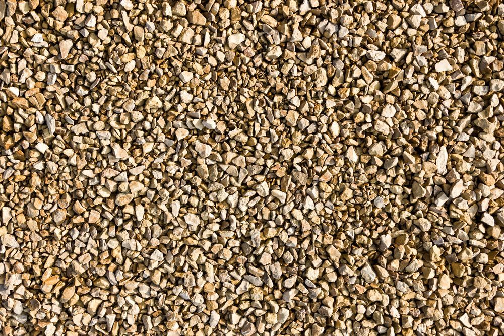 Close-Up of a Surface Covered in Small Tan Gravel — Boland Contracting In Wellington, NSW