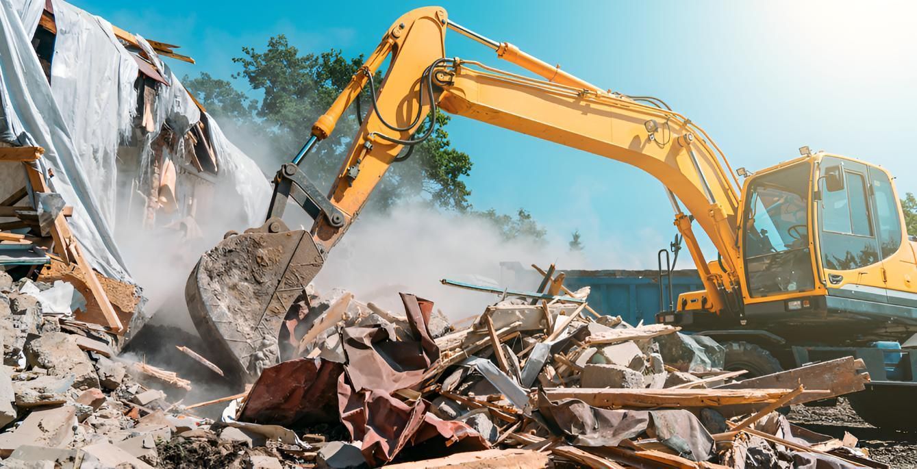 Yellow Excavator Demolishing a Building Creating Dust in a Sunny Outdoor Setting — Boland Contracting In Wellington, NSW