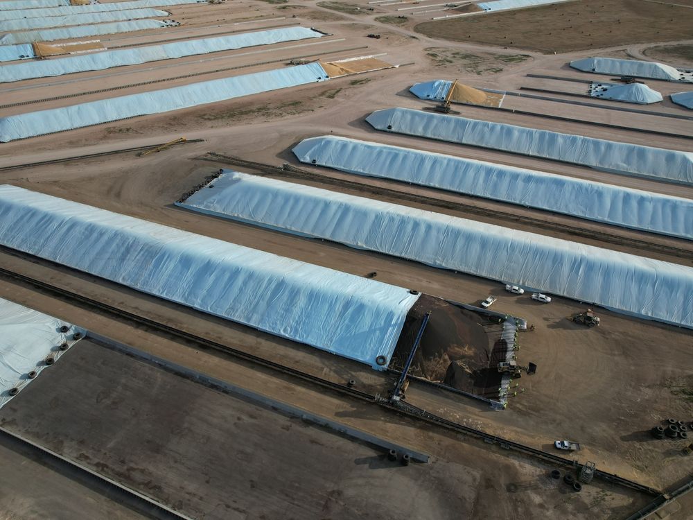 Aerial view of agricultural facility with white-covered storage structures — Boland Contracting In Wellington, NSW