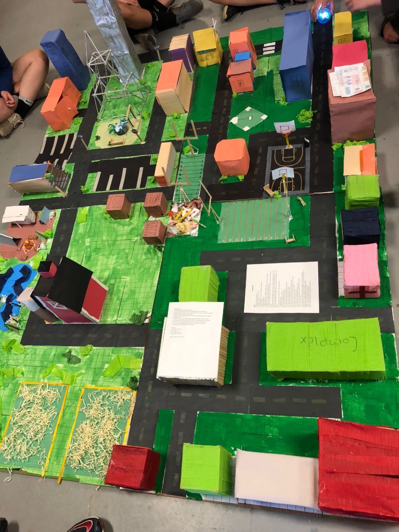 A model of a city with the word atlanta written on a piece of paper