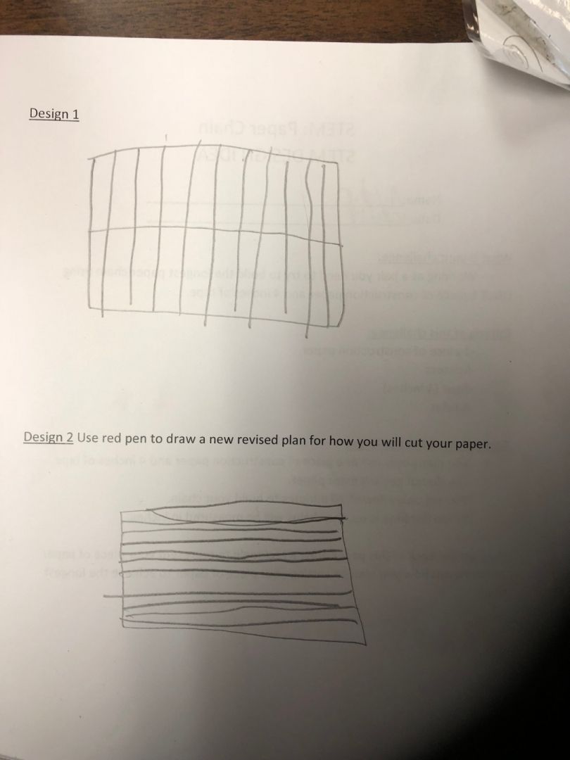 A piece of paper with a drawing of a fence on it