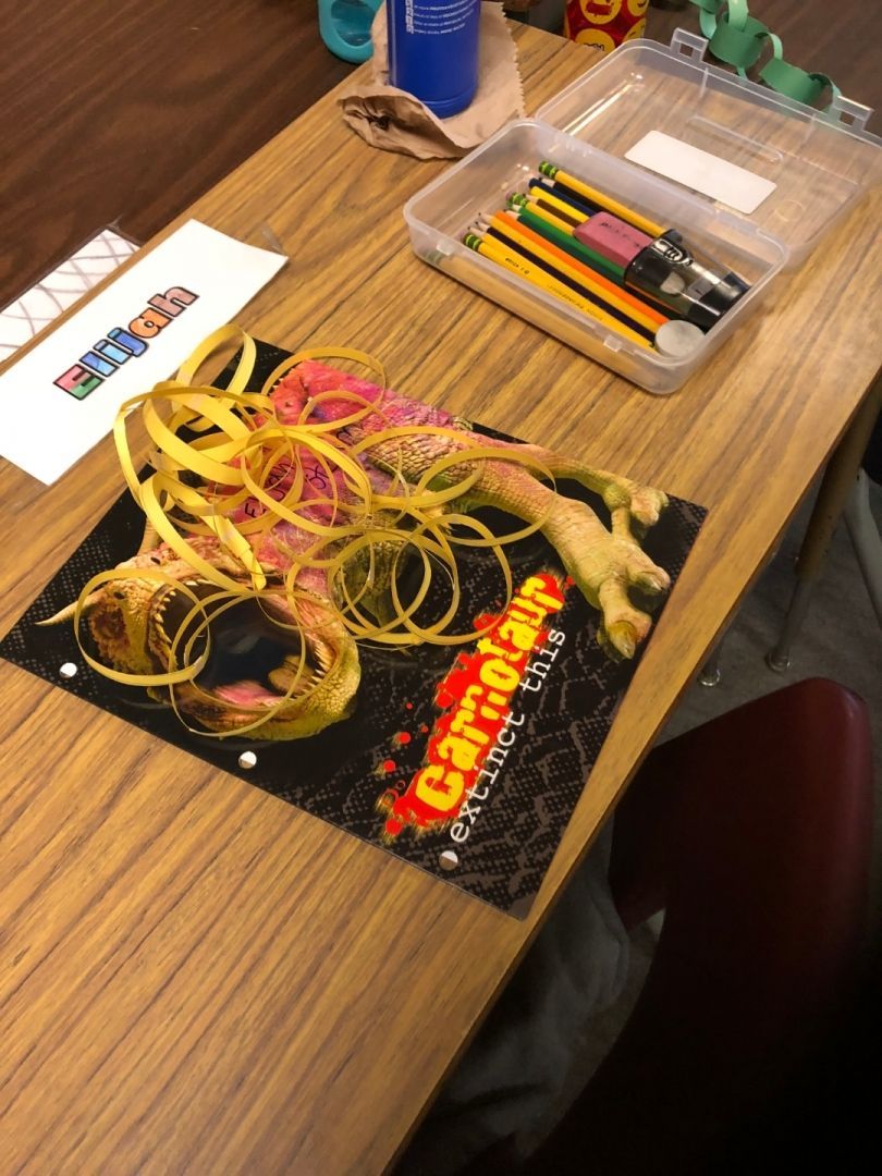 A wooden table with a poster that says game of thrones on it