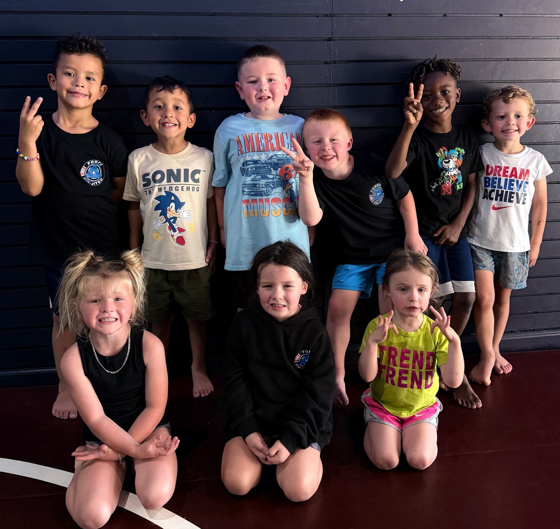 Toddlers jiu-jitsu class posing for a picture