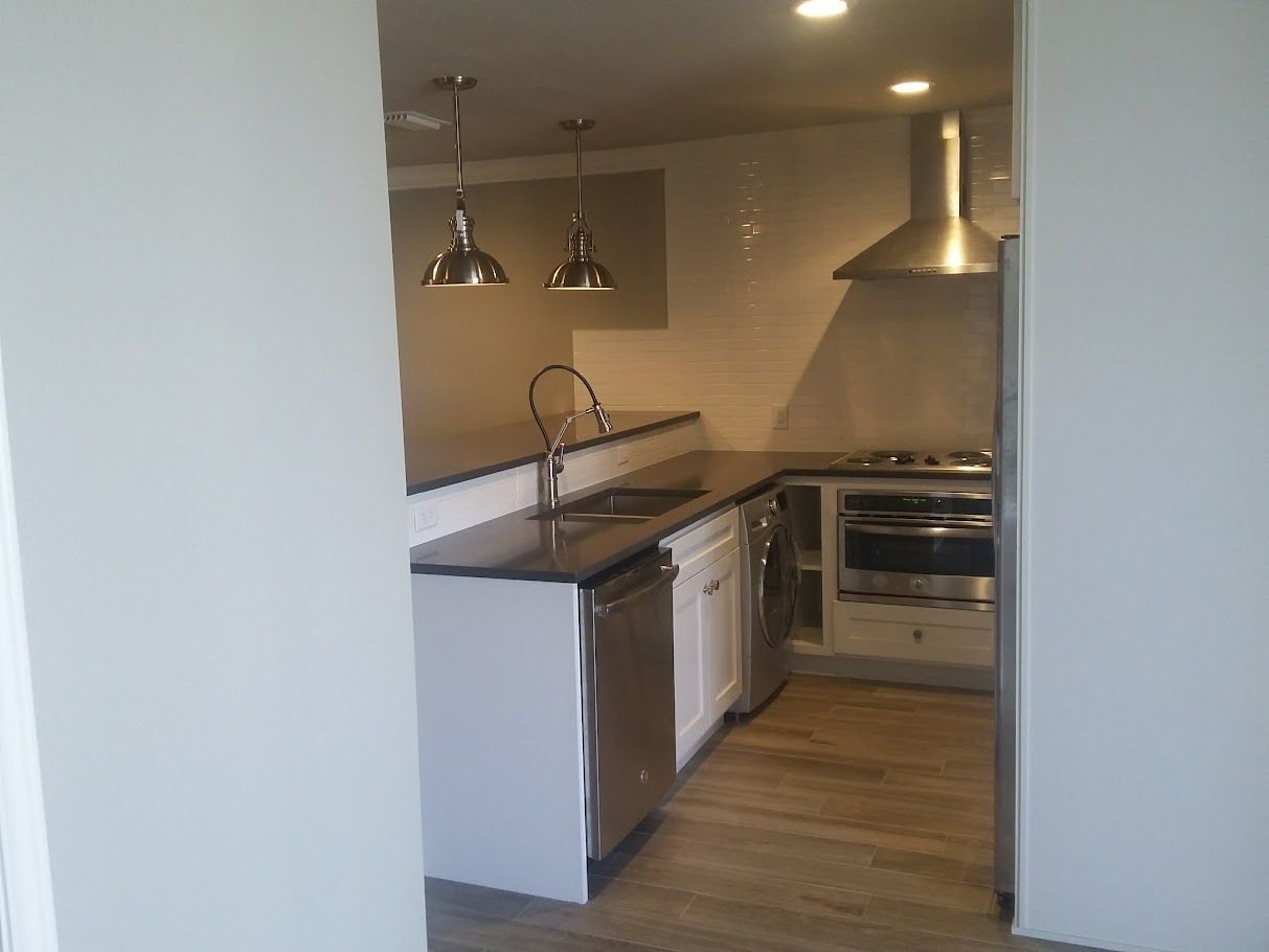 A kitchen with stainless steel appliances and a sink