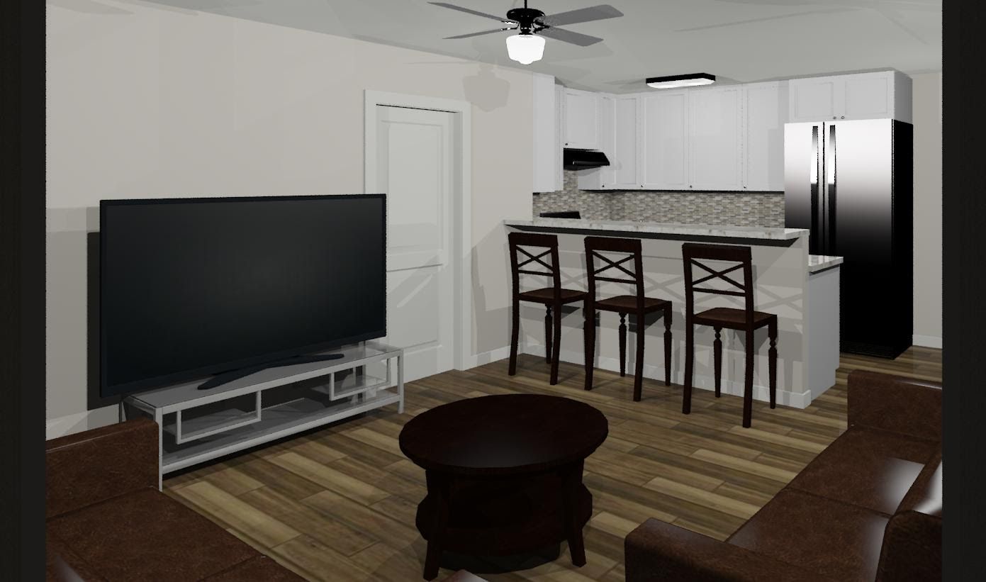 A living room with a flat-screen TV, a couch, a table, and chairs.