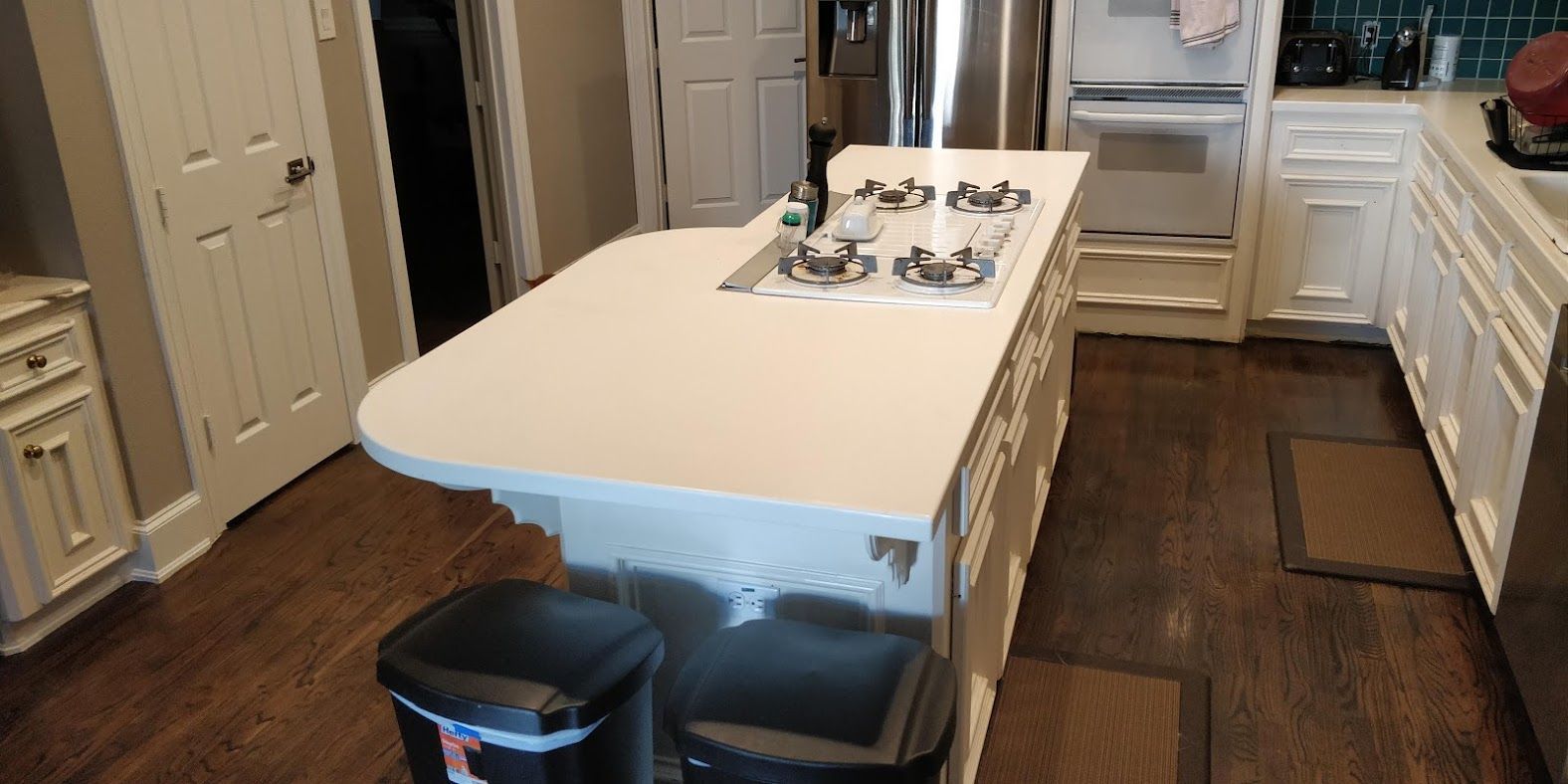 A kitchen with a large island in the middle of it.