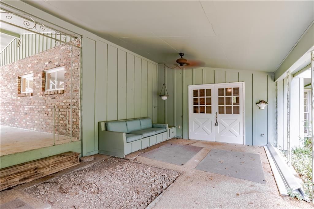 A living room with a couch and a ceiling fan