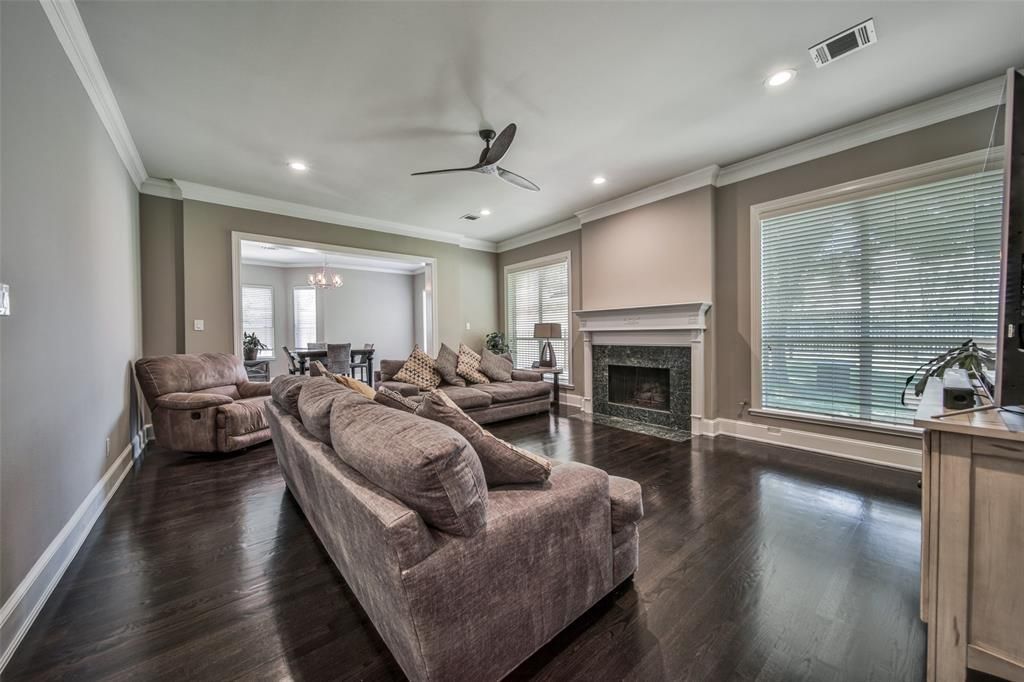 A living room filled with furniture and a fireplace.