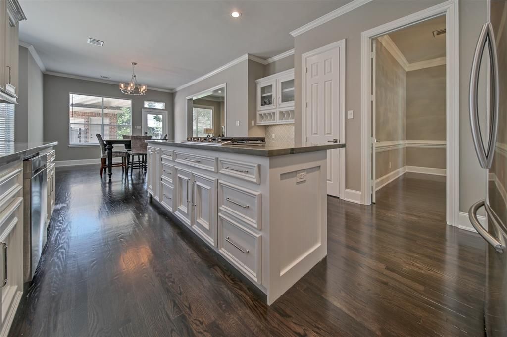 A kitchen with a large island in the middle of the room.