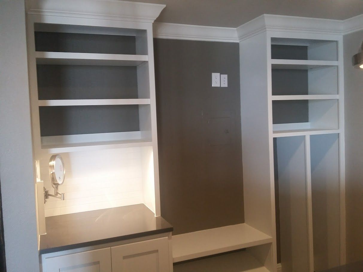 A room with a lot of shelves and cabinets