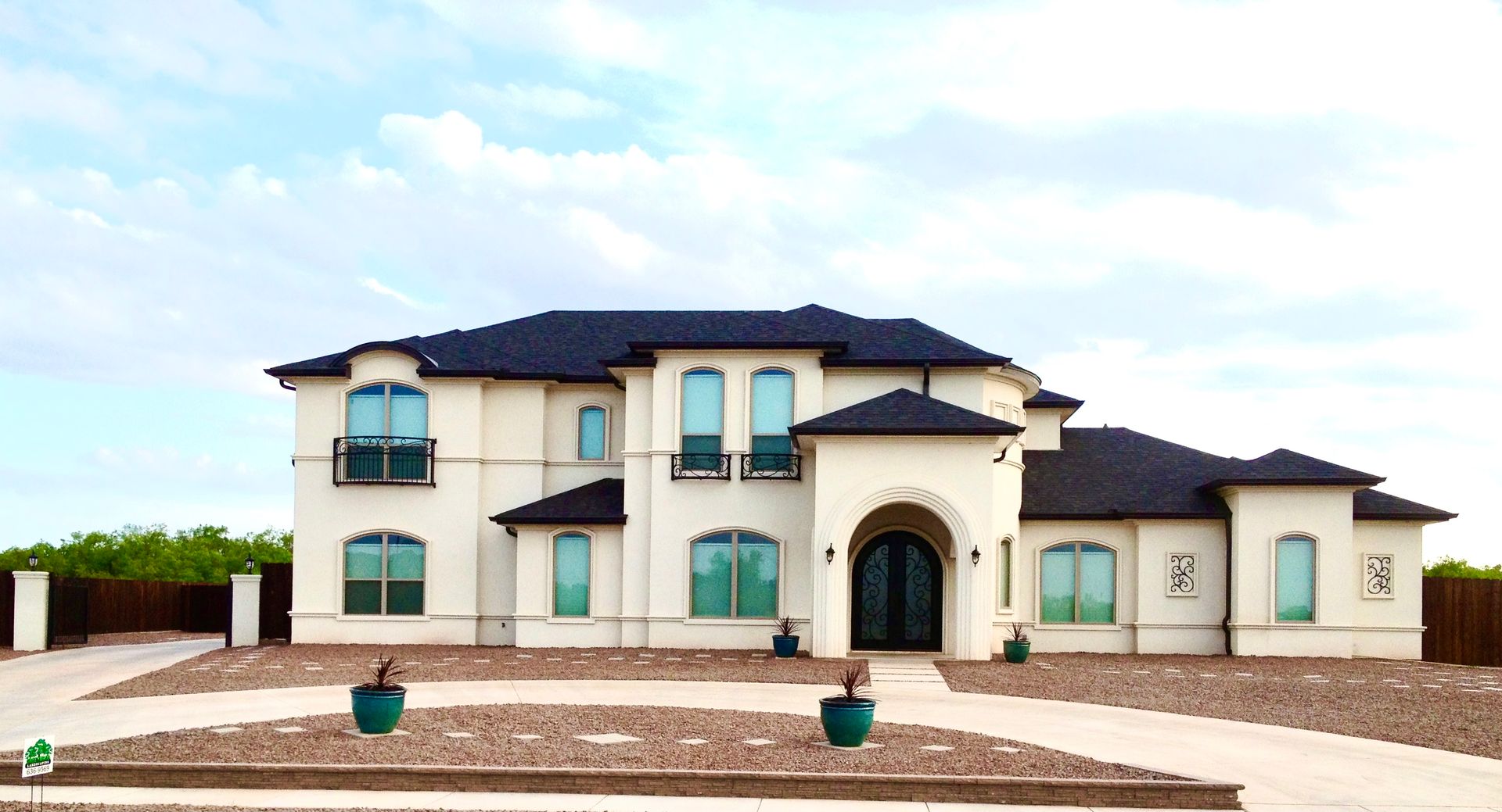 A large white house with a black roof