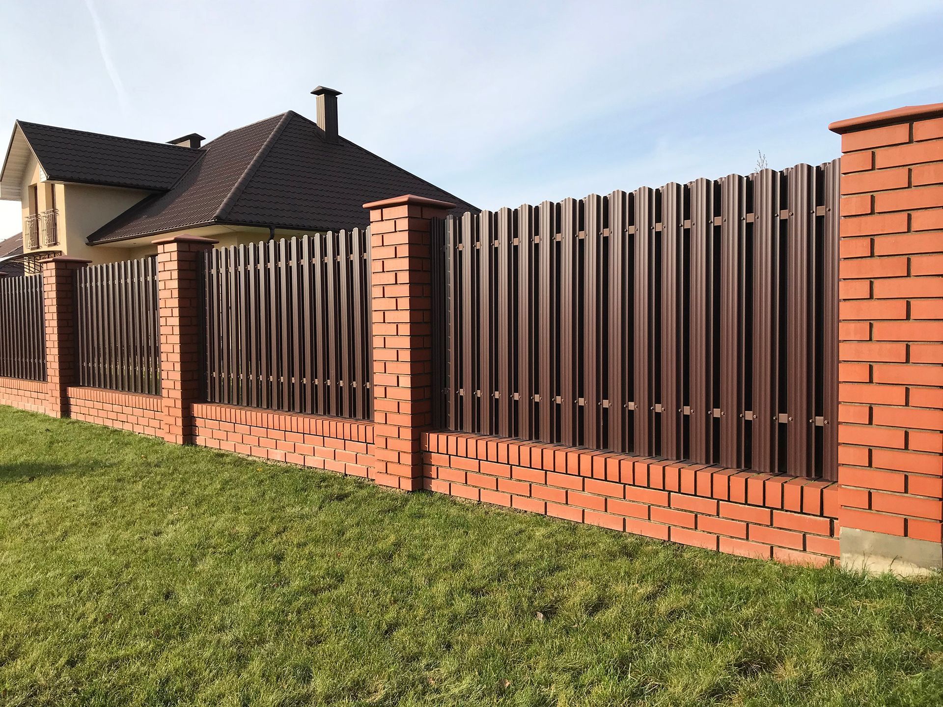 brown metal fencing outside a house