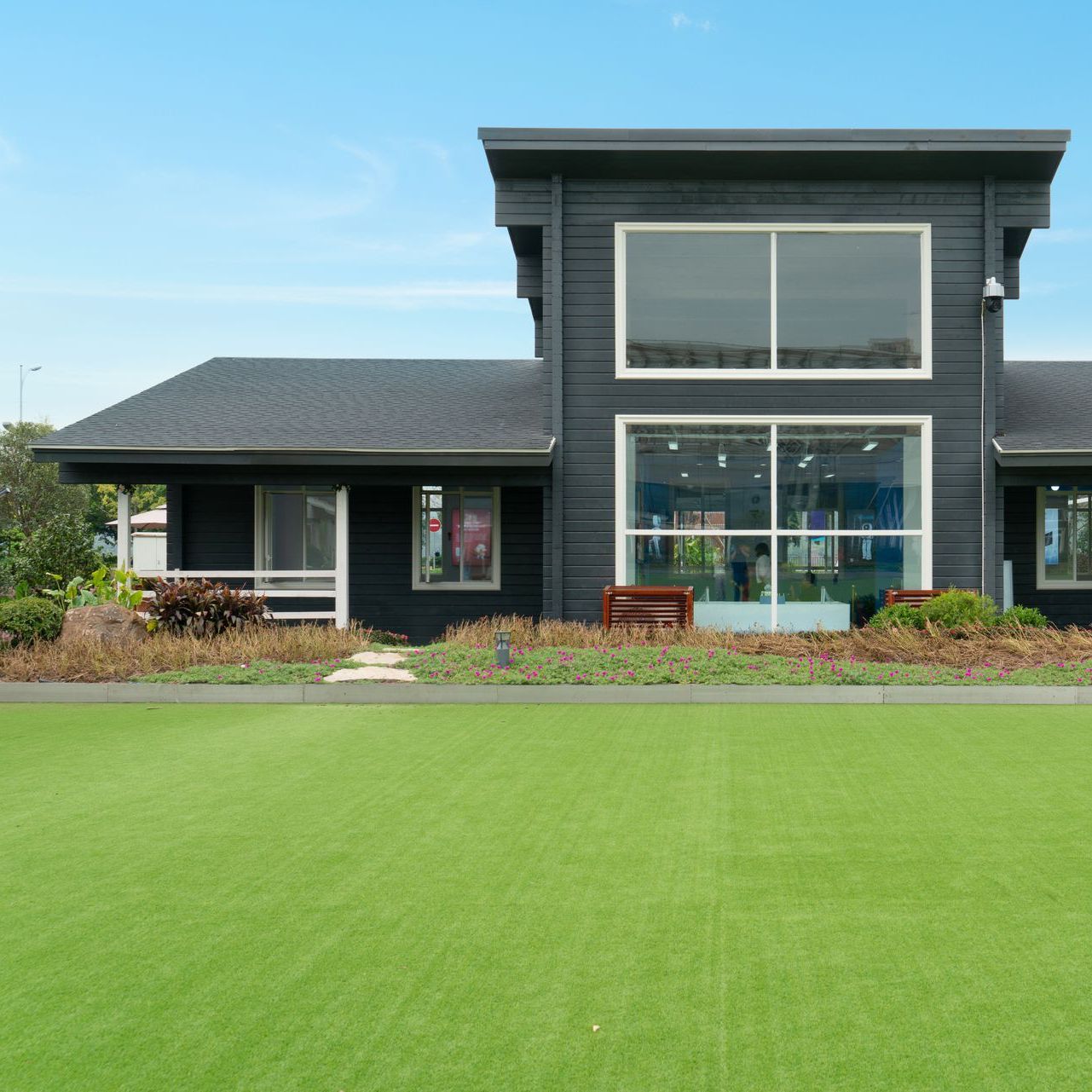 a large black house with a lot of windows