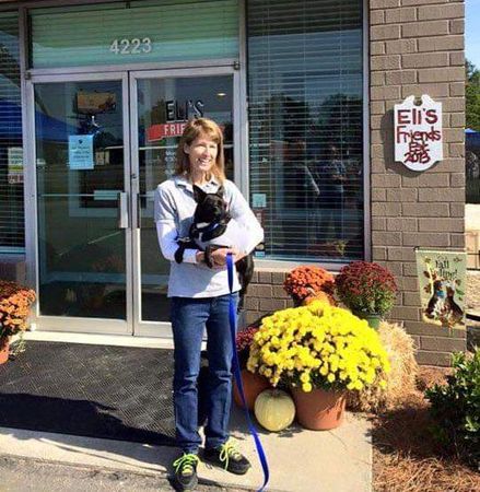 Woman Carrying a Dog — Goldsboro, NC — Eli's Friends