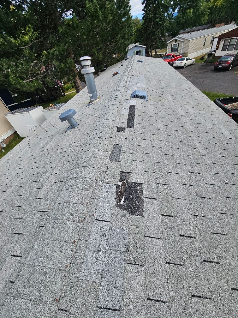kalispell roofing pros - missing shingles - roof damage kalispell - storm damage roof repair