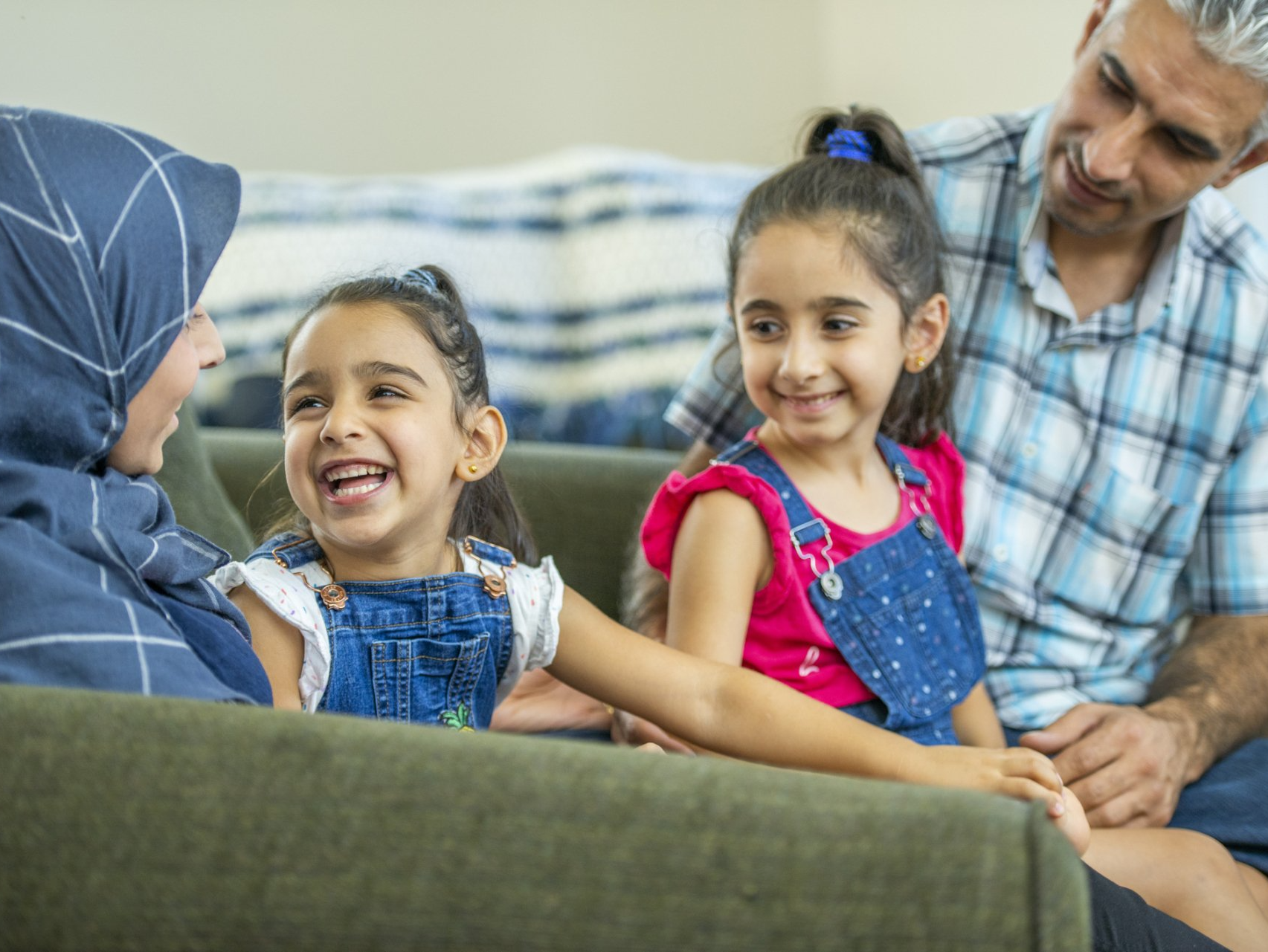 Family smiling at home