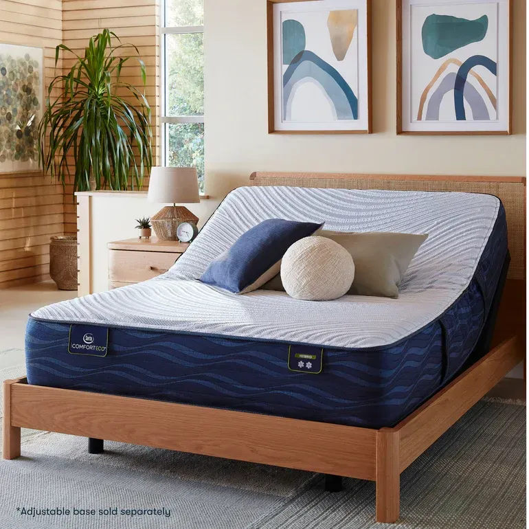 A bed with a blue mattress and pillows on it