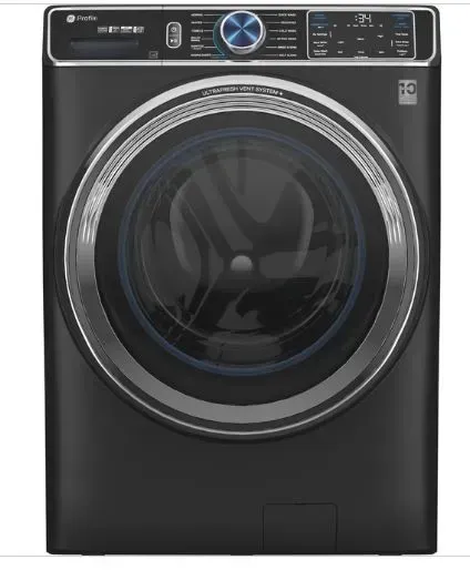 A black washer and dryer is sitting on a white surface