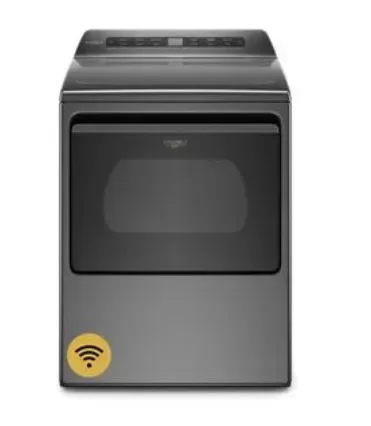 A gray dryer with a yellow sticker on it