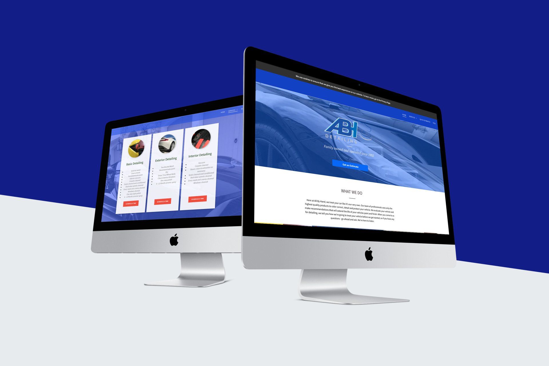 two computer monitors are sitting next to each other on a table .