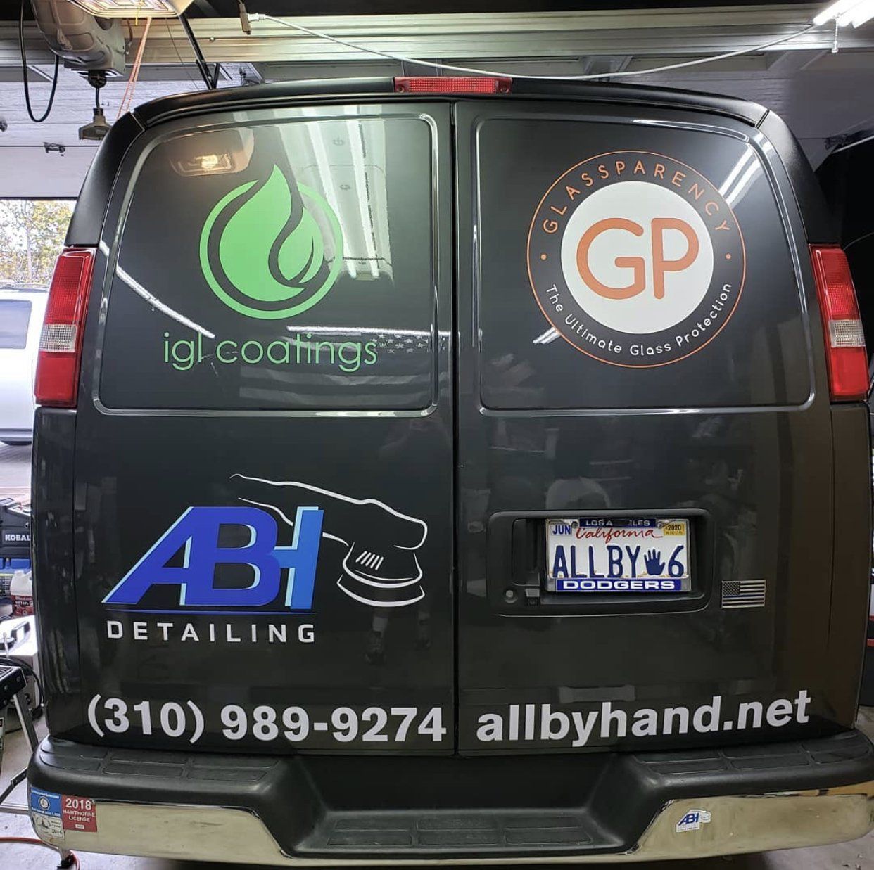 a black van with a gp logo on the back