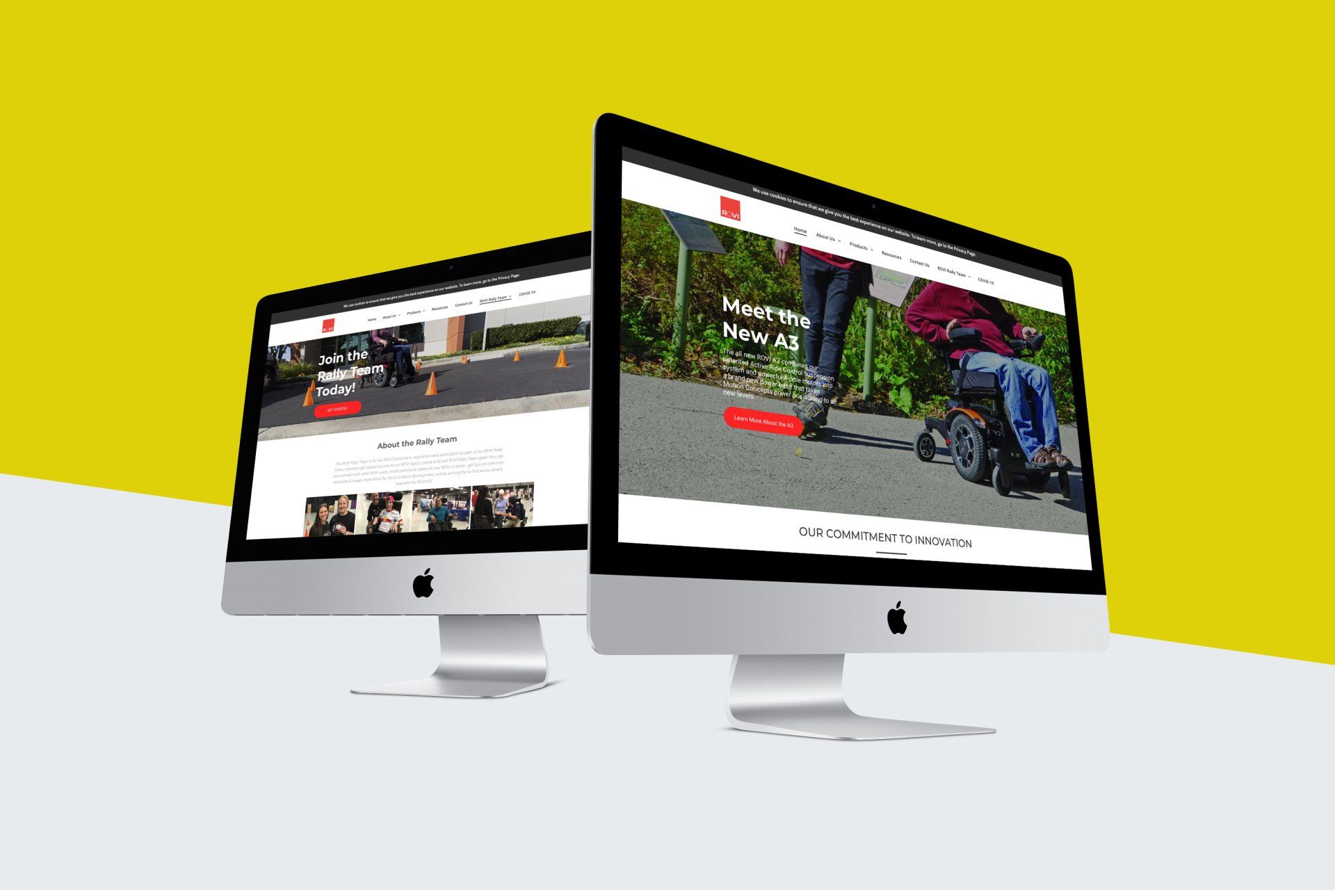 two computer monitors are sitting on a table with a yellow background .