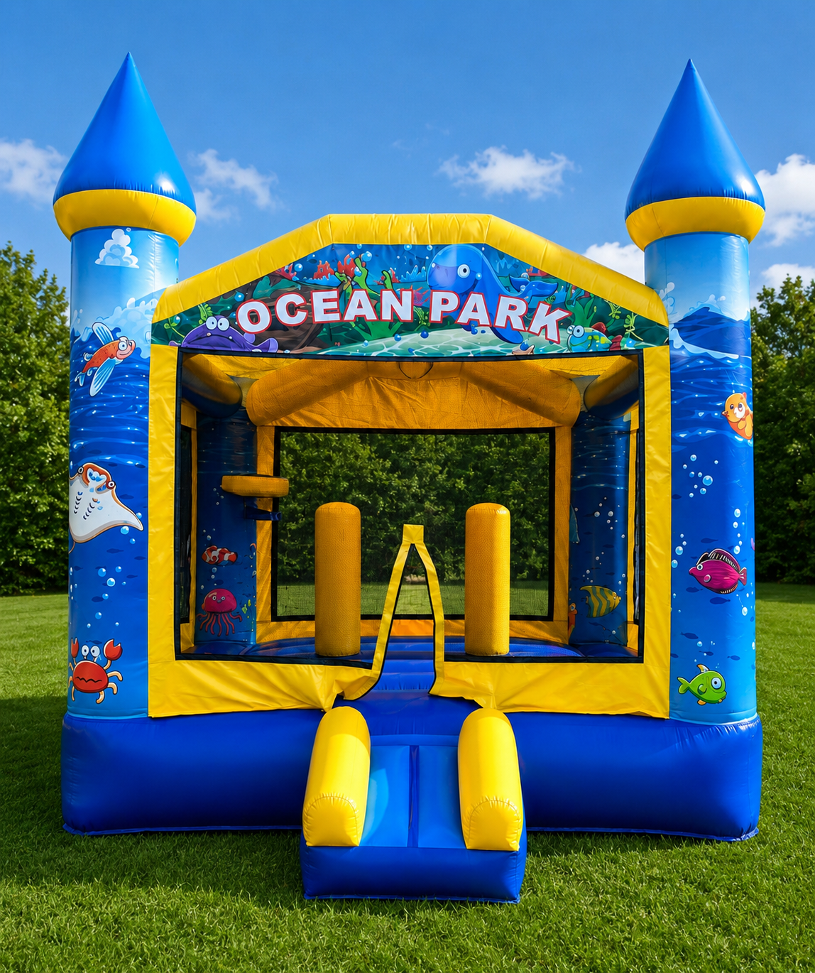 Blue and yellow Ocean Park inflatable bounce house with castle towers on grass under a sunny sky