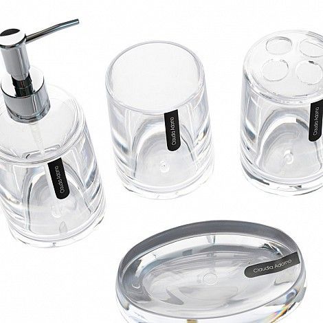 Juego de accesorios de baño: dispensador de jabón transparente, vaso, portacepillos de dientes y jabonera.