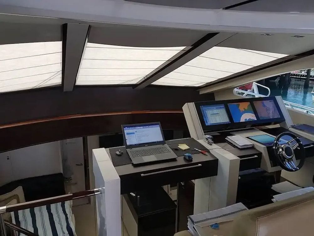 A Laptop Computer is Sitting on Top of a Desk in the Cockpit of a Boat — Seabourne Electronics PTY Ltd in Railway Estate, QLD