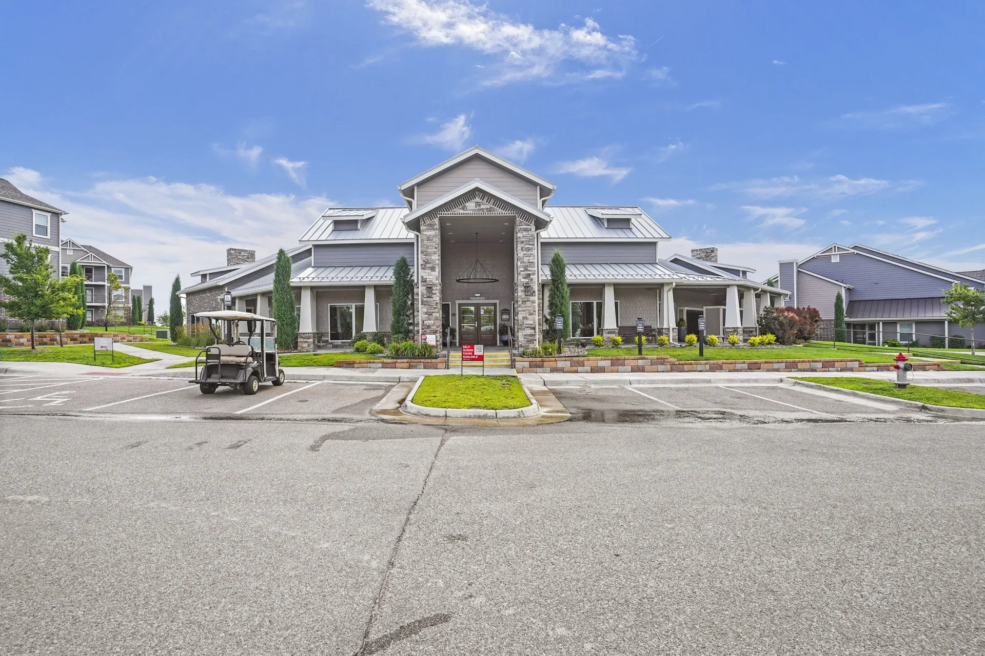 A large house with a driveway in front of it.