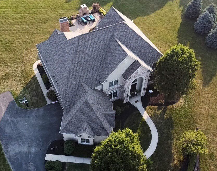 an aerial view of an asphalt shingle roof replaced by Roofers Cincinnati