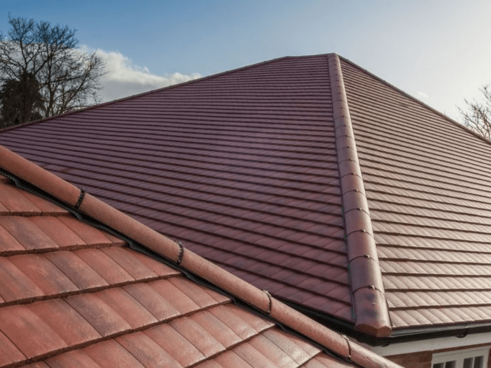 A picture of new installed clay roof tiles on a pitched roof by Roofers Cincinnati