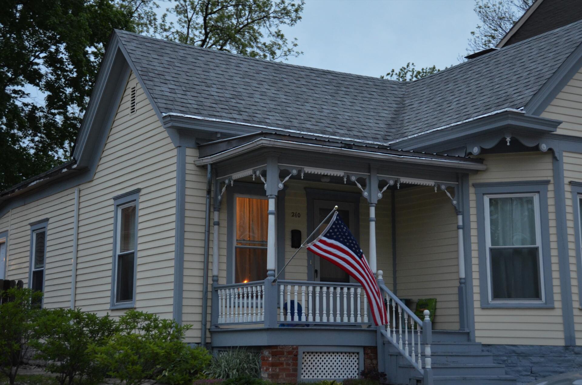 A gable roof with grey slates constructed by Roofers Cincinnati.