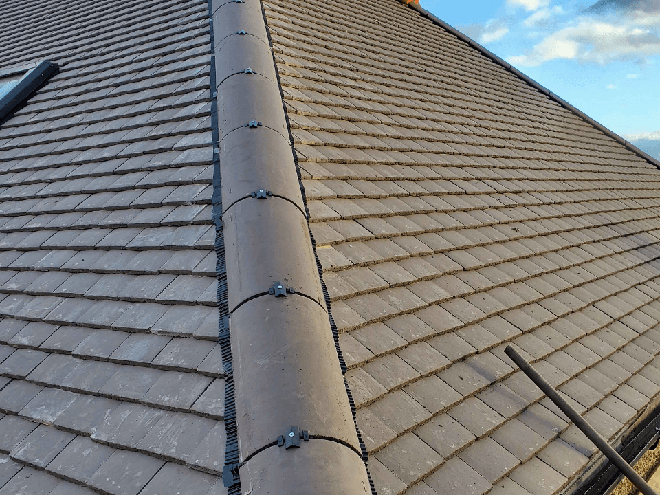 A picture of a shingled hip roof installed by Roofers Cincinnati