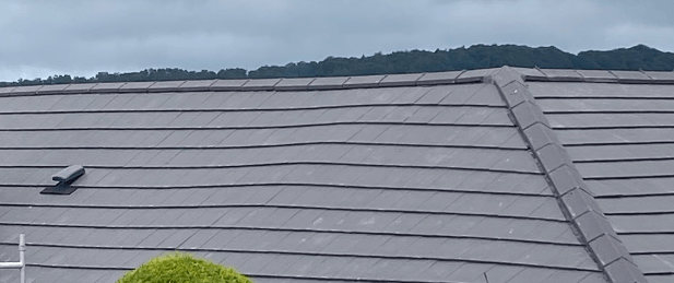 A picture of a grey tiled roof installed by Roofers in Cincinnat